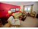 Living room features a sofa, two armchairs, and a coffee table at 701 S Green Cir, Venice, FL 34285