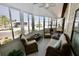 Relaxing sunroom with ample seating and gorgeous views at 701 S Green Cir, Venice, FL 34285