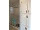 Clean bathroom with shower stall and built-in storage at 723 Locarno Dr, Venice, FL 34285