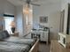 Bedroom with desk, en-suite bathroom and ceiling fan at 723 Locarno Dr, Venice, FL 34285