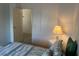 Bedroom with bed, nightstand, and door to hallway at 723 Locarno Dr, Venice, FL 34285