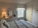 Bedroom with dresser, bed, and window with blinds at 723 Locarno Dr, Venice, FL 34285