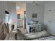 Bedroom with desk, en-suite bathroom and ceiling fan at 723 Locarno Dr, Venice, FL 34285