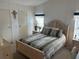 Bedroom with light wood furniture and bedding at 723 Locarno Dr, Venice, FL 34285