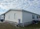 Side view of a mobile home showcasing its exterior at 723 Locarno Dr, Venice, FL 34285