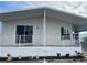 Front view of a mobile home, showcasing its exterior features at 723 Locarno Dr, Venice, FL 34285