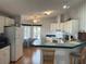 Kitchen with white cabinets and breakfast nook at 723 Locarno Dr, Venice, FL 34285
