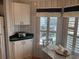 Cozy kitchen nook with white cabinets and window seat at 723 Locarno Dr, Venice, FL 34285