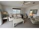 Living room with couch, armchairs, and coffee table at 723 Locarno Dr, Venice, FL 34285