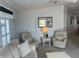 Living room with two comfy armchairs and a coffee table at 723 Locarno Dr, Venice, FL 34285