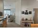 Living room with beige walls, comfortable seating and view of hallway at 723 Locarno Dr, Venice, FL 34285