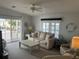 Bright living room featuring a comfy couch and coffee table at 723 Locarno Dr, Venice, FL 34285