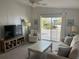 Spacious living room with ample natural light and comfy seating at 723 Locarno Dr, Venice, FL 34285
