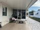 Screened porch with patio furniture, creating a relaxing outdoor space at 723 Locarno Dr, Venice, FL 34285