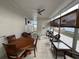 Screened-in porch with dining and seating areas at 723 Locarno Dr, Venice, FL 34285