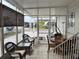 Screened-in porch with dining and seating areas at 723 Locarno Dr, Venice, FL 34285