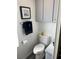 Bathroom with toilet, cabinet, and a towel rack at 788 Cervina Dr, Venice, FL 34285
