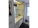 Clean bathroom with sink, mirror, and cabinet at 788 Cervina Dr, Venice, FL 34285
