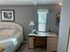 Bedroom with a desk and wicker bed at 788 Cervina Dr, Venice, FL 34285