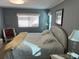 Bedroom with a king-size bed and sitting area at 788 Cervina Dr, Venice, FL 34285