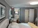 Bright bedroom with a comfortable bed and built-in dresser at 788 Cervina Dr, Venice, FL 34285