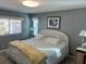 Main bedroom with large bed and wicker furniture at 788 Cervina Dr, Venice, FL 34285