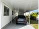 Covered carport with concrete parking pad at 788 Cervina Dr, Venice, FL 34285