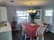Bright dining area with a table for four and white chairs at 788 Cervina Dr, Venice, FL 34285