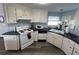 White kitchen with updated countertops and appliances at 788 Cervina Dr, Venice, FL 34285