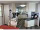 Galley kitchen with white cabinets and granite countertops at 788 Cervina Dr, Venice, FL 34285