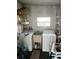 Laundry room with washer, dryer, and extra storage at 788 Cervina Dr, Venice, FL 34285