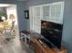 Living room with rocking chair and view into another living area at 788 Cervina Dr, Venice, FL 34285