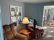 Living area with two armchairs and built-in shelving at 788 Cervina Dr, Venice, FL 34285