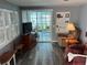 Living room features a sliding glass door to a screened porch at 788 Cervina Dr, Venice, FL 34285