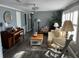 Bright and airy living room with comfy seating and a piano at 788 Cervina Dr, Venice, FL 34285