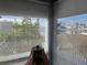 Sunroom with water views and white mini blinds at 788 Cervina Dr, Venice, FL 34285
