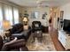 Living area with leather couches and hardwood floors at 827 Baveno Dr, Venice, FL 34285