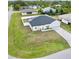 This is an aerial view of the home, showcasing the well-maintained lawn and the neighborhood at 8307 Glover Ave, North Port, FL 34291