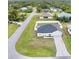 House with driveway and yard, viewed from above at 8307 Glover Ave, North Port, FL 34291