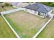 Aerial view of house with large backyard and solar panels at 8307 Glover Ave, North Port, FL 34291