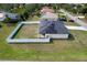Aerial view of a fenced yard with solar panels on a well-maintained single-story home at 8307 Glover Ave, North Port, FL 34291