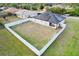 Aerial view showing a home's large backyard, enclosed by a fence at 8307 Glover Ave, North Port, FL 34291