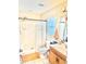 Bathroom featuring a shower with a white shower curtain, toilet, and a wood-finished vanity with sink at 8307 Glover Ave, North Port, FL 34291