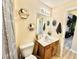 Bathroom features a single sink vanity, a toilet, and decorative hexagon shelves at 8307 Glover Ave, North Port, FL 34291