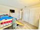 Playful bedroom with a bunkbed, closet, wood floors, and an attached TV at 8307 Glover Ave, North Port, FL 34291