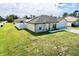 A beautiful home with a well-manicured lawn and a spacious driveway leading to the attached garage at 8307 Glover Ave, North Port, FL 34291