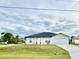 Charming single-story home with a well-maintained front lawn and attached two-car garage at 8307 Glover Ave, North Port, FL 34291
