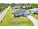A charming single-story home with a well-maintained lawn and an attached garage at 8307 Glover Ave, North Port, FL 34291