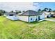 A beautiful home with a well-manicured lawn and a spacious driveway leading to the attached garage at 8307 Glover Ave, North Port, FL 34291