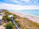 Aerial view of pristine beach with boardwalk at 869 Cascade Ct, Englewood, FL 34223